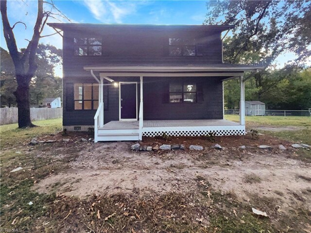 3877 Welcome Arcadia Rd, Lexington, NC 27295 - view of front facade featuring crawl space, fence, an outbuilding, and a shed
