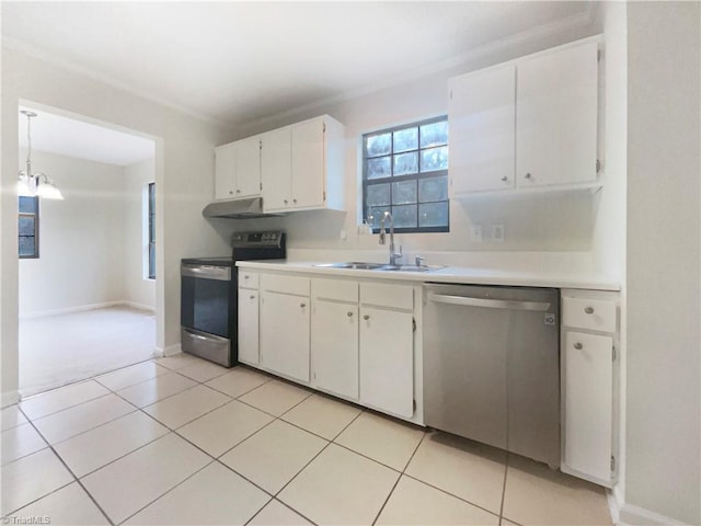 kitchen with stainless steel appliances, sink, decorative light fixtures, light tile patterned floors, and white cabinets