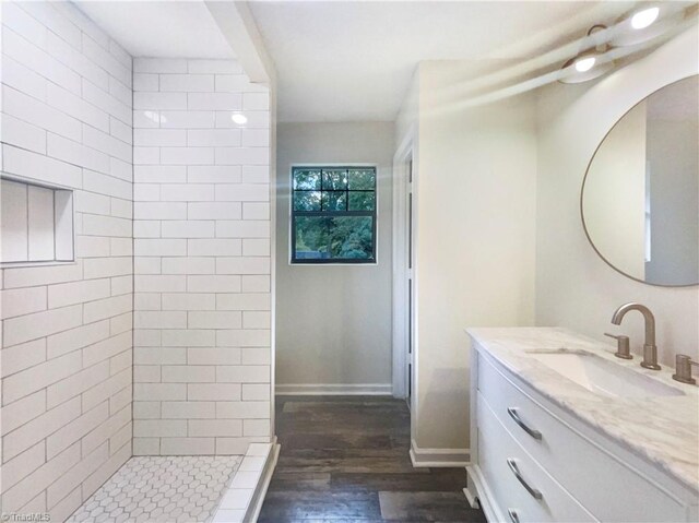 3877 Welcome Arcadia Rd, Lexington, NC 27295 - full bathroom with baseboards, a tile shower, wood finished floors, and vanity