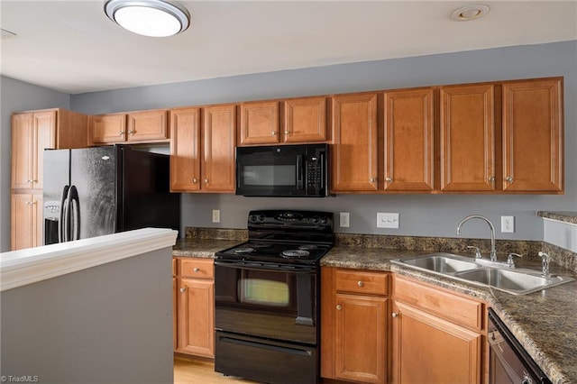 kitchen featuring sink and black appliances