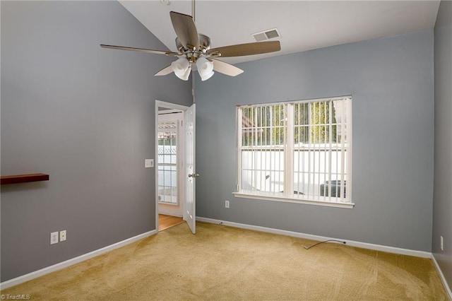 carpeted empty room featuring ceiling fan