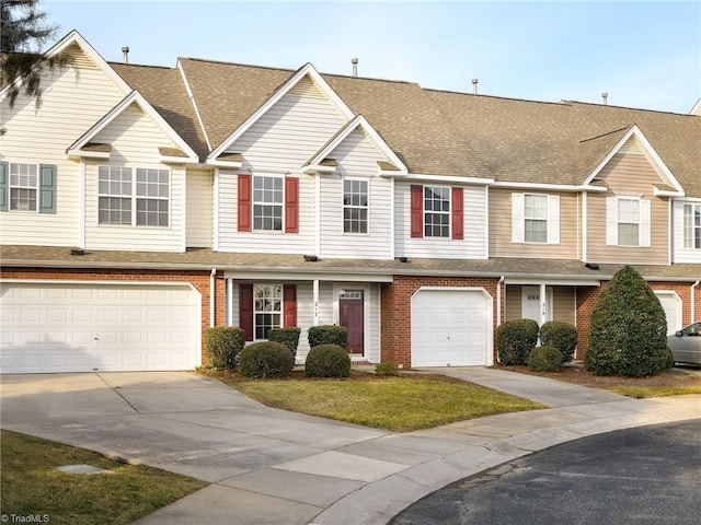 multi unit property featuring a garage