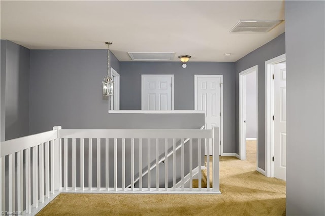 corridor with carpet flooring