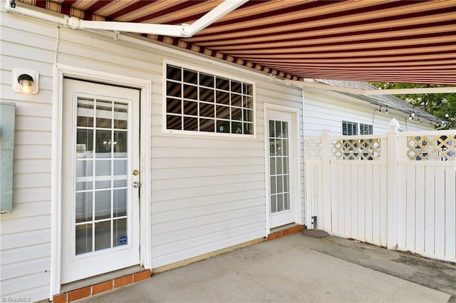 doorway to property featuring a patio area