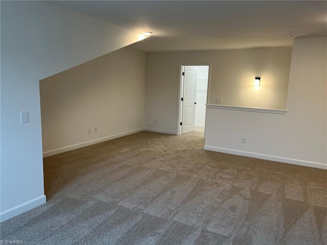 interior space featuring carpet and lofted ceiling