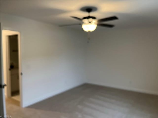 spare room with ceiling fan