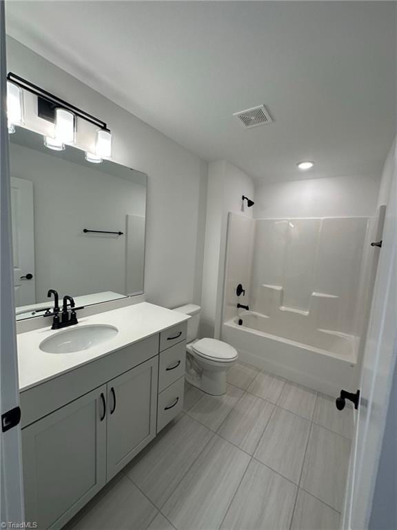 full bathroom featuring vanity, toilet, and shower / washtub combination