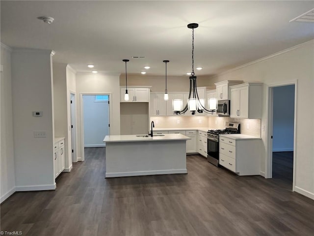 kitchen featuring white cabinets, sink, stainless steel appliances, and dark wood-type flooring