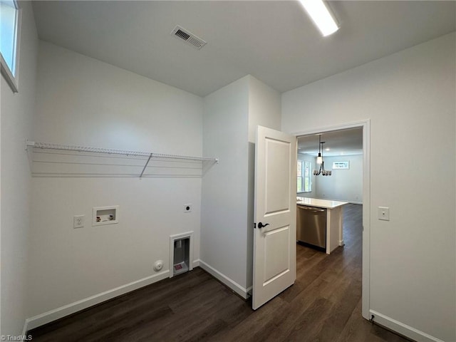 laundry room with hookup for a gas dryer, dark hardwood / wood-style flooring, washer hookup, and hookup for an electric dryer