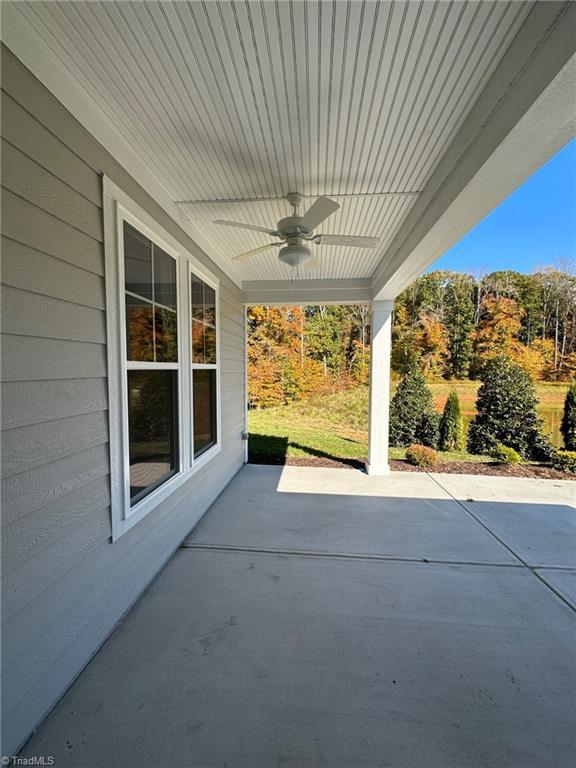 view of patio / terrace featuring ceiling fan