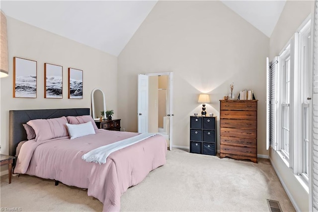 carpeted bedroom featuring high vaulted ceiling, visible vents, and baseboards