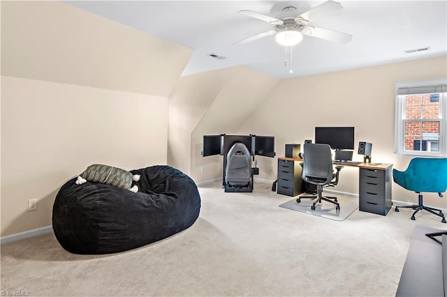 office space with light carpet, lofted ceiling, visible vents, and baseboards