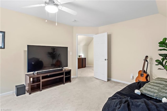 bedroom with light carpet, baseboards, and a ceiling fan