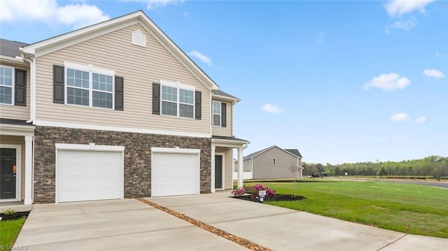 view of front facade with a garage and a front yard