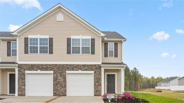 view of front facade with a garage and a front yard