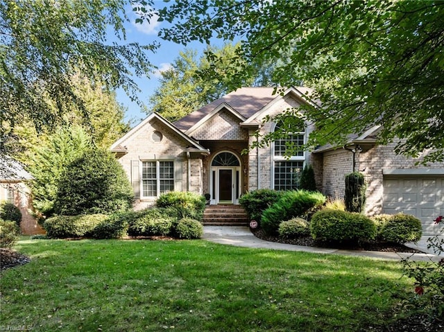 view of front facade with a front lawn and a garage