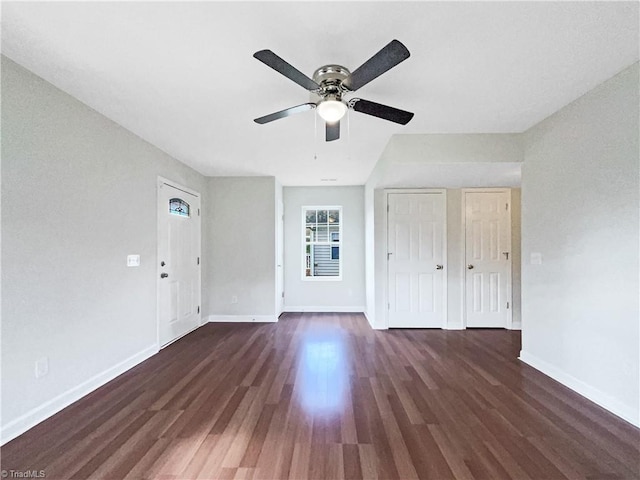 interior space with ceiling fan and dark hardwood / wood-style flooring