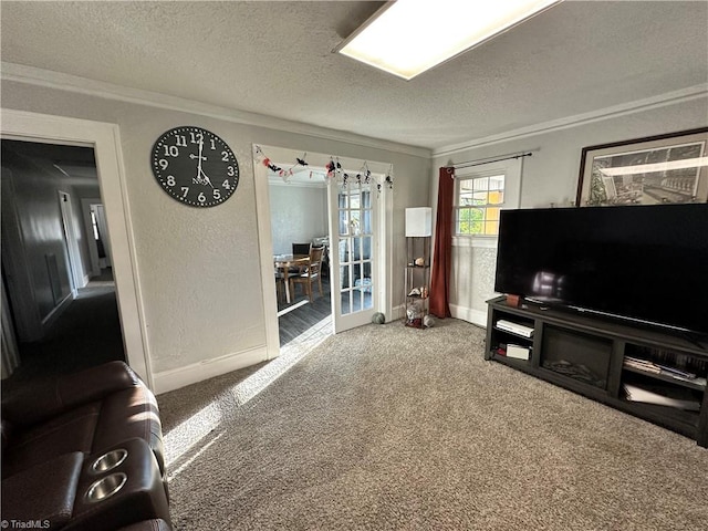 living room with a textured ceiling, crown molding, and carpet flooring