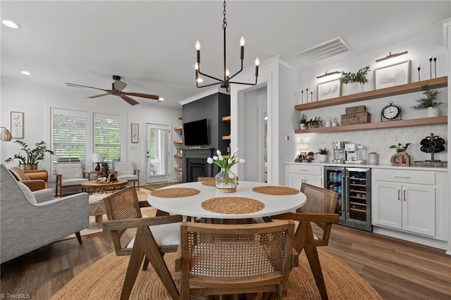 5120 Whaitley Ln, Greensboro, NC 27407 - dining space with beverage cooler, wet bar, dark wood finished floors, recessed lighting, and ceiling fan
