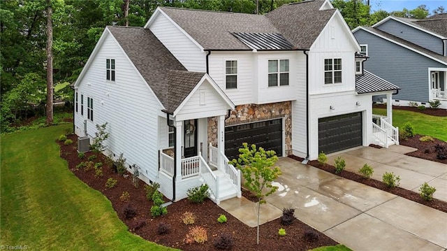 5120 Whaitley Ln, Greensboro, NC 27407 - modern farmhouse style home featuring a garage, driveway, a front yard, and roof with shingles