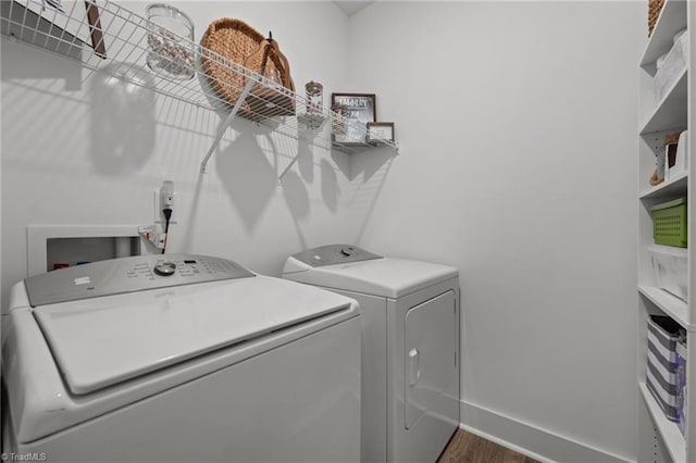 5120 Whaitley Ln, Greensboro, NC 27407 - laundry room with washer and dryer, dark wood finished floors, and baseboards