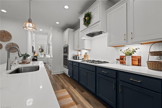5120 Whaitley Ln, Greensboro, NC 27407 - kitchen featuring a sink, appliances with stainless steel finishes, blue cabinetry, white cabinetry, and recessed lighting