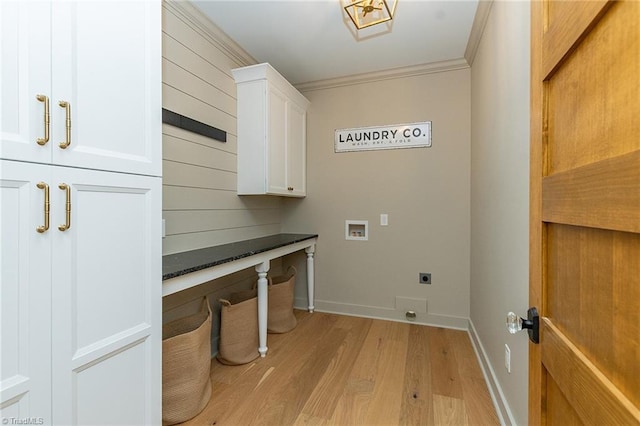 clothes washing area with ornamental molding, light hardwood / wood-style floors, electric dryer hookup, washer hookup, and cabinets