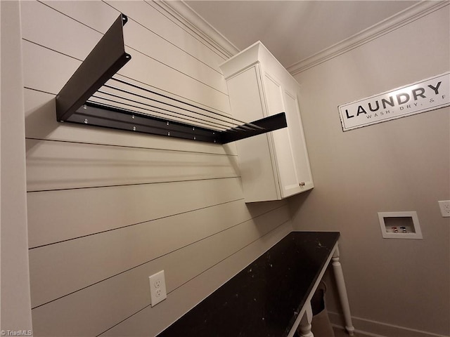 laundry area featuring ornamental molding, hookup for a washing machine, and cabinets