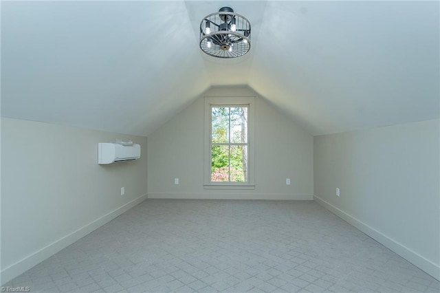 bonus room with lofted ceiling and a wall mounted AC