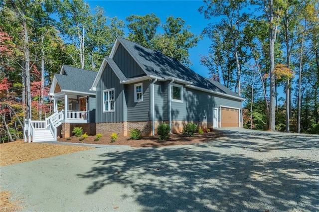 view of front of home featuring covered porch and a garage