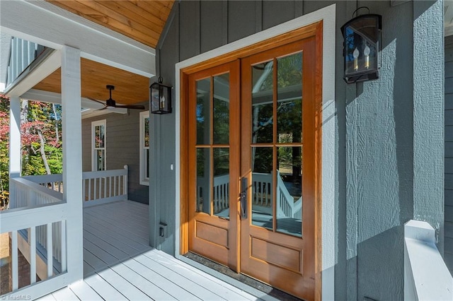 view of exterior entry with french doors and ceiling fan