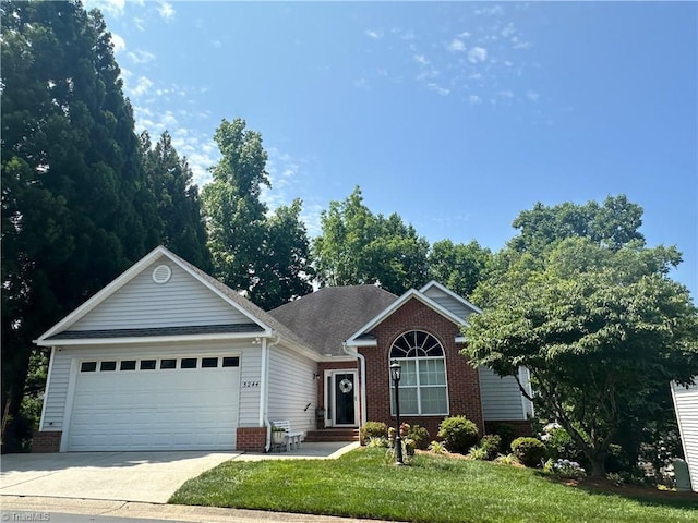 5244 Old Plantation Cir, Winston-Salem, NC 27104 - single story home with brick siding, a garage, driveway, and a front lawn