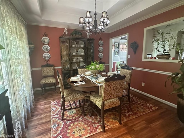 5244 Old Plantation Cir, Winston-Salem, NC 27104 - dining space with a chandelier, wood finished floors, a raised ceiling, baseboards, and ornamental molding