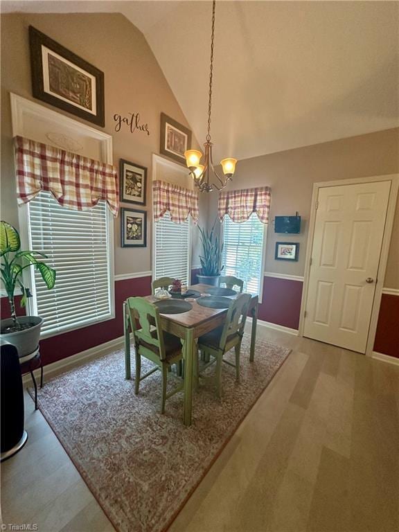 5244 Old Plantation Cir, Winston-Salem, NC 27104 - dining area with a chandelier, lofted ceiling, and baseboards