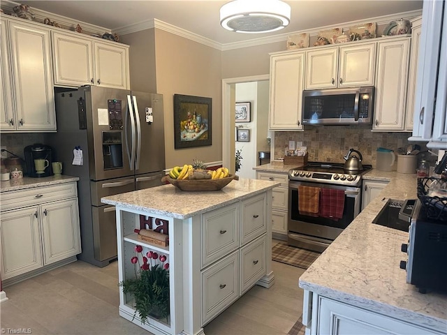 5244 Old Plantation Cir, Winston-Salem, NC 27104 - kitchen with stainless steel appliances, crown molding, backsplash, light stone countertops, and a center island