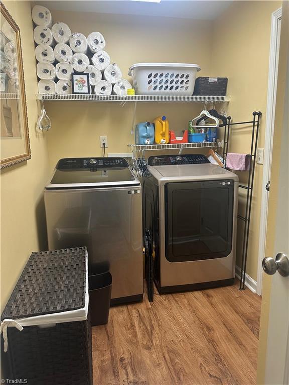 5244 Old Plantation Cir, Winston-Salem, NC 27104 - laundry area featuring washer and dryer and wood finished floors
