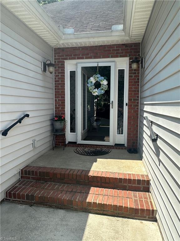 5244 Old Plantation Cir, Winston-Salem, NC 27104 - view of exterior entry featuring brick siding