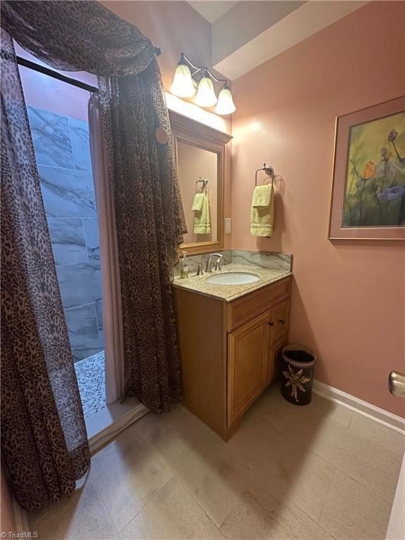5244 Old Plantation Cir, Winston-Salem, NC 27104 - bathroom featuring vanity and baseboards
