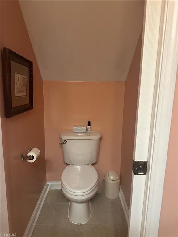 5244 Old Plantation Cir, Winston-Salem, NC 27104 - bathroom featuring baseboards, vaulted ceiling, toilet, and tile patterned flooring