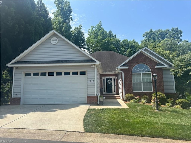 5244 Old Plantation Cir, Winston-Salem, NC 27104 - ranch-style house with brick siding, driveway, a front yard, and an attached garage