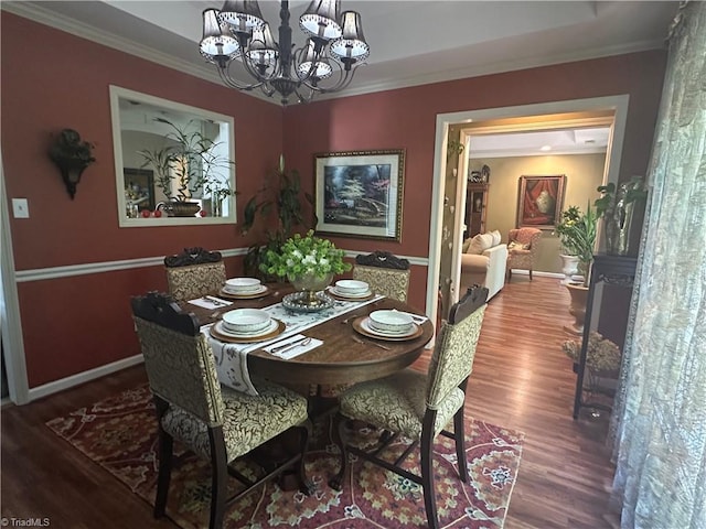 5244 Old Plantation Cir, Winston-Salem, NC 27104 - dining area with wood finished floors, a chandelier, crown molding, and baseboards