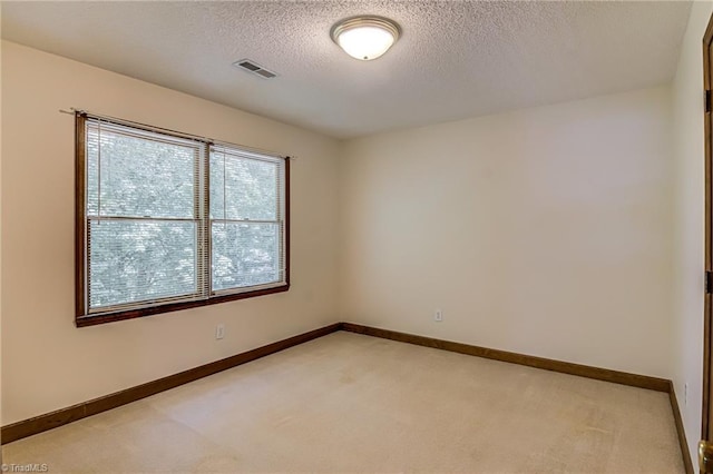 417 Avery Ave, High Point, NC 27265 - unfurnished room featuring light colored carpet and a textured ceiling
