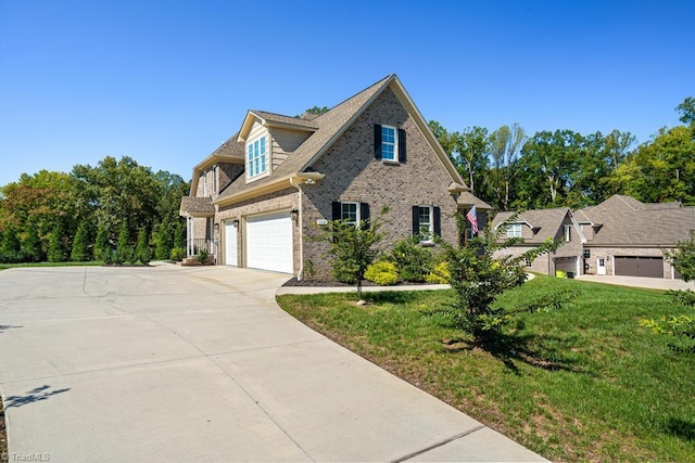 view of front of property with a garage and a front yard