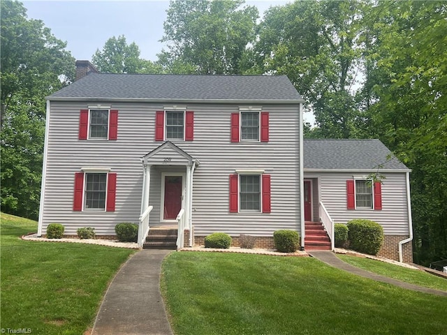 209 Cedar Ln, North Wilkesboro, NC 28659 - colonial home with a chimney, a front lawn, and roof with shingles