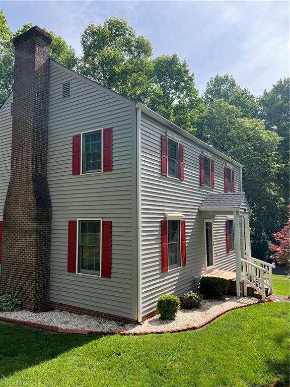 209 Cedar Ln, North Wilkesboro, NC 28659 - view of side of home with a chimney and a yard