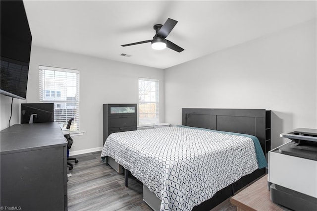 bedroom featuring hardwood / wood-style floors and ceiling fan