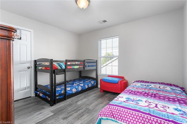 bedroom with wood-type flooring