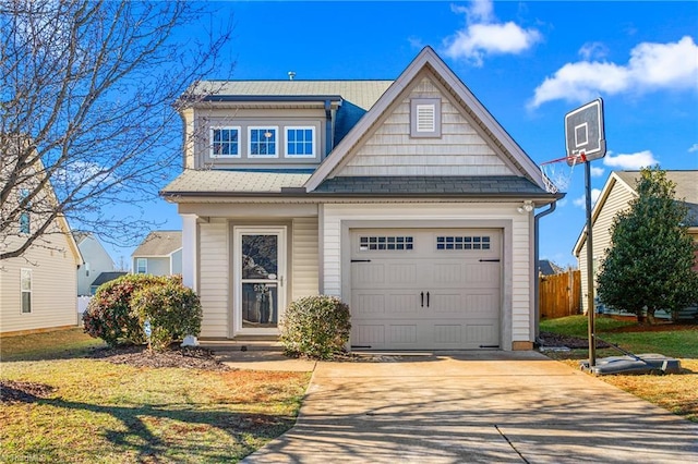 view of front of house with a front yard and a garage