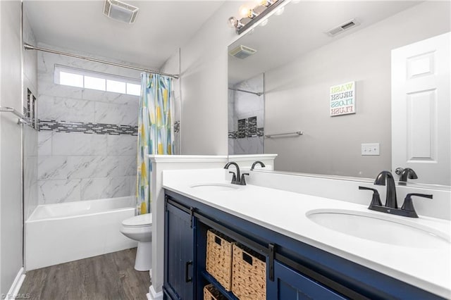 full bathroom with wood-type flooring, vanity, toilet, and shower / bathtub combination with curtain