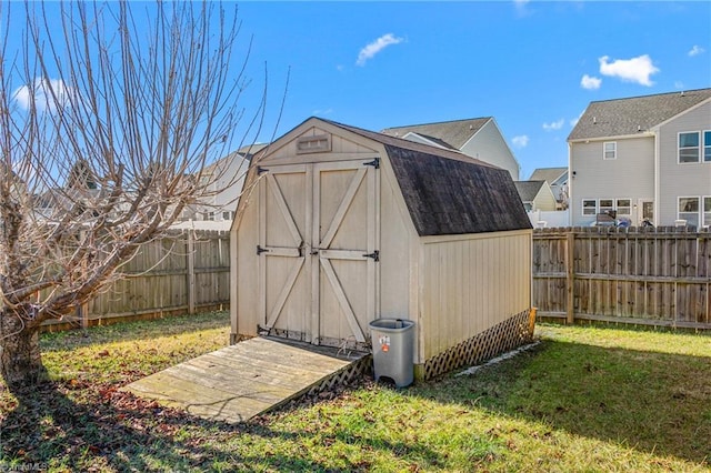 view of outbuilding with a yard